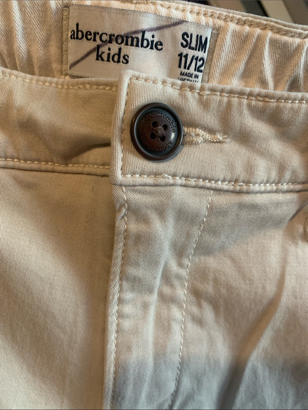 abercrombie kids slim khaki pants in cream